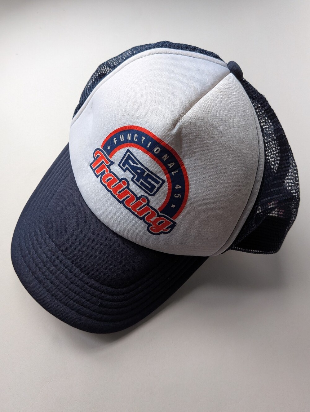 F45 navy blue and white trucker baseball mesh hat